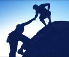 One climber reaching down to help another climber