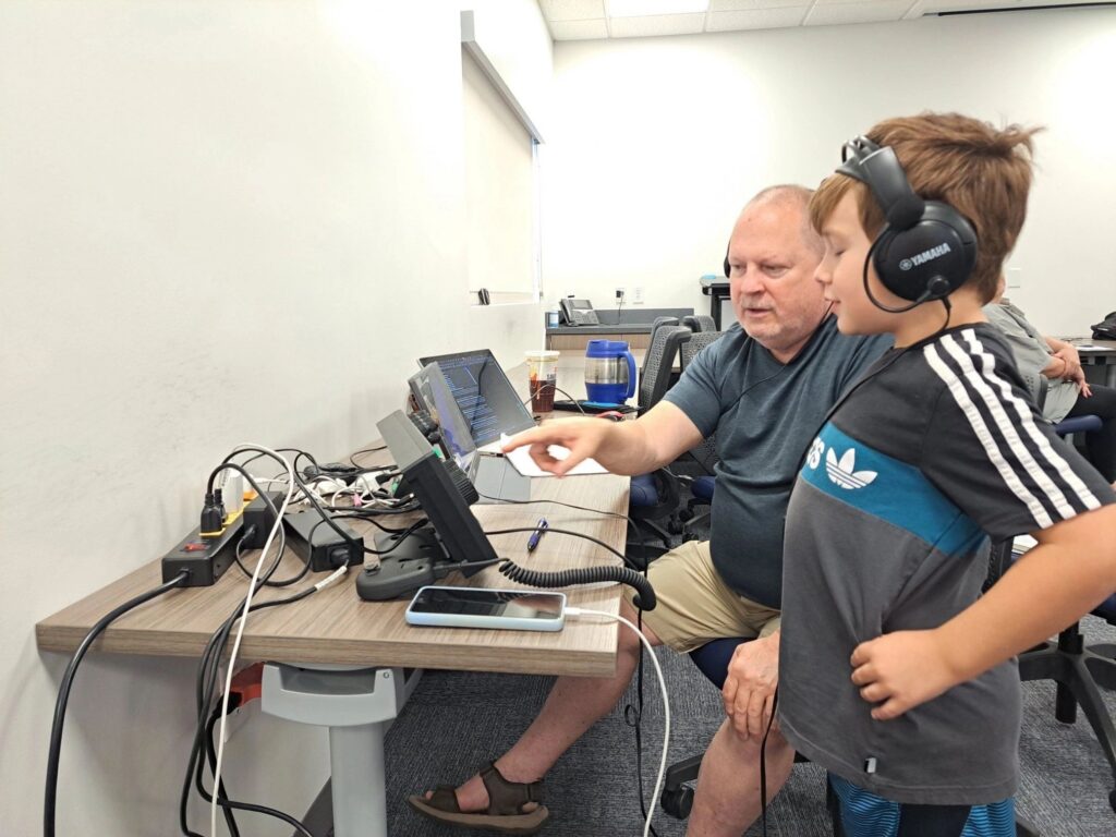 A young visitor learning amateur radio at WVARC Field Day