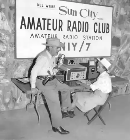 George Mezey, K7NIY, and Georgie, K7NOA, at a Sun City Amateur Radio Club demonstration display in 1962.