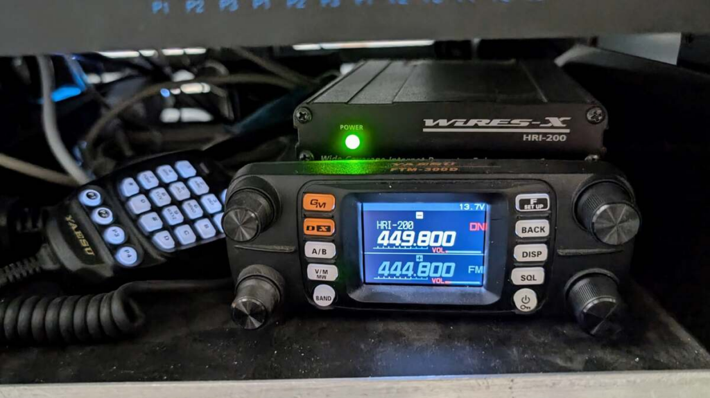Yaesu FTM-300D linking radio beneath an HRI-200 WIRES-X interface at the NY7S repeater site.