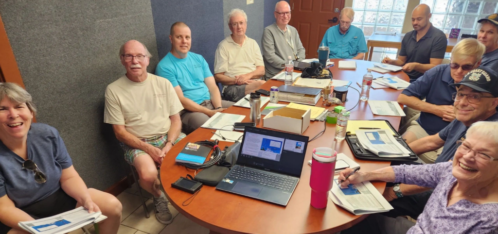 West Valley Ham Shack members and visitors gathered around a conference table during a classroom session.