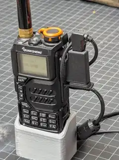 Handheld radio mounted on a compact AIOC AllStarLink node base